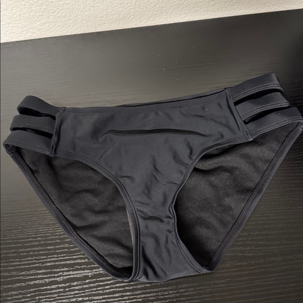 Ocean blues black bikini bottom with side cutouts